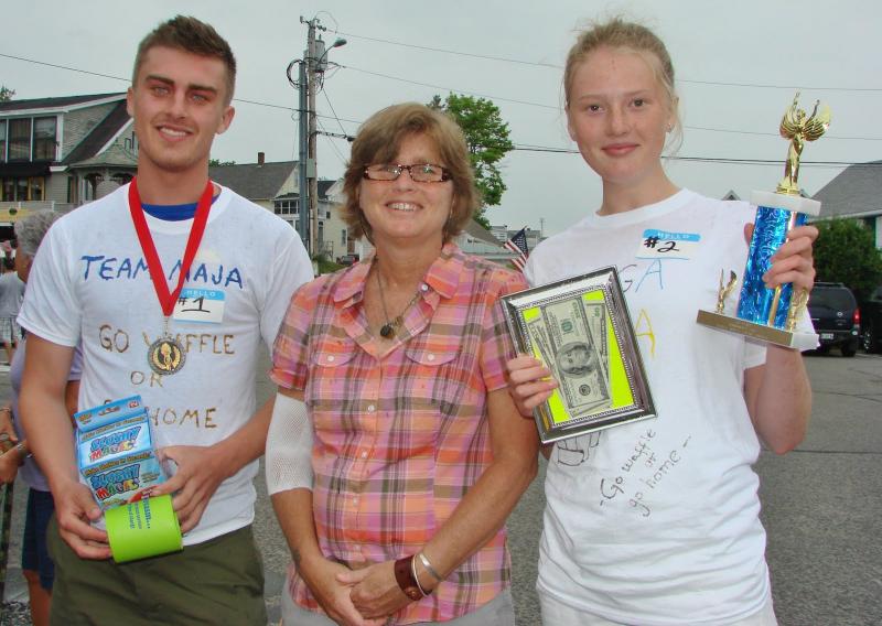 The first and second place winners of Wannawaf's eighth annual waffle-eating contest Anton and Maja Ekman with the recipient of the fundraising event Pam Creamer, center, who suffers from chronic Lyme disease. LISA KRISTOFF/Boothbay Register